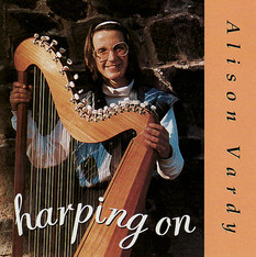Cover of Alison's CD Harping On photo of her in Dunedin New Zealand holding her hand-made Paraguayan harp