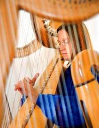 Alison seen through the harp strings