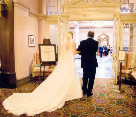 Bride and her father entering Palm Court in Fairmont Empress Hotel, Victoria BC